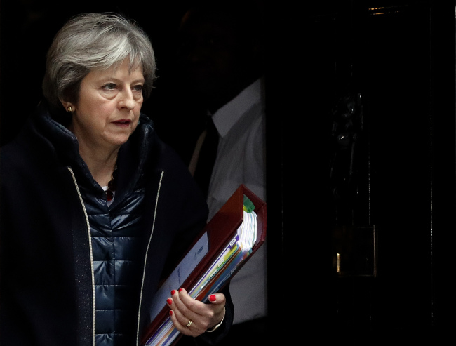 Britain's Prime Minister Theresa May leaves 10 Downing Street to attend the weekly Prime Minister's Questions session, in parliament in London, Wednesday, March 14, 2018. [Photo: AP/Frank Augstein]