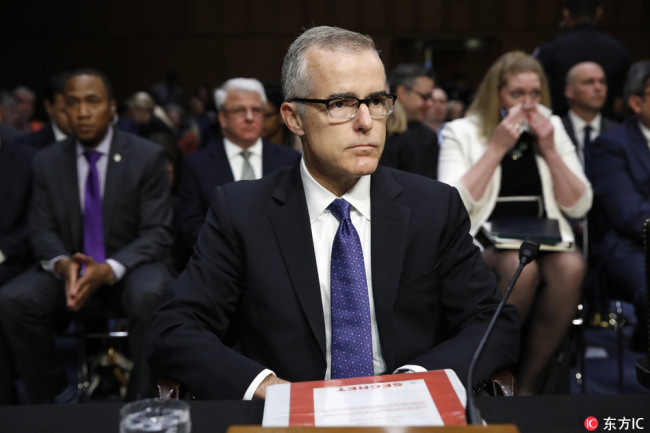 Acting FBI Director Andrew McCabe sits with a folder marked "Secret" in front of him while testifying on Capitol Hill in Washington, Thursday, May 11, 2017, before the Senate Intelligence Committee hearing on major threats facing the U.S. [File Photo: IC]