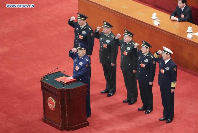 Xu Qiliang and Zhang Youxia, vice chairmen of the Central Military Commission (CMC) of the People's Republic of China, and CMC members Wei Fenghe, Li Zuocheng, Miao Hua and Zhang Shengmin pledge allegiance to the country's Constitution in the Great Hall of the People in Beijing, capital of China, March 18, 2018. Xu Qiliang and Zhang Youxia were endorsed as vice chairmen of the CMC of the People's Republic of China at the annual session of the 13th National People's Congress (NPC) Sunday morning. Wei Fenghe, Li Zuocheng, Miao Hua and Zhang Shengmin were endorsed as the CMC members. [Photo: Xinhua/Pang Xinglei]