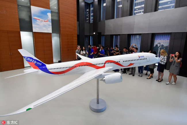 A model of the CR929 wide-body long-range passenger aircraft to be developed by China and Russia is on display at the headquarters of the Commercial Aircraft Corporation of China (COMAC) in Shanghai on September 29, 2017. [Photo: IC]