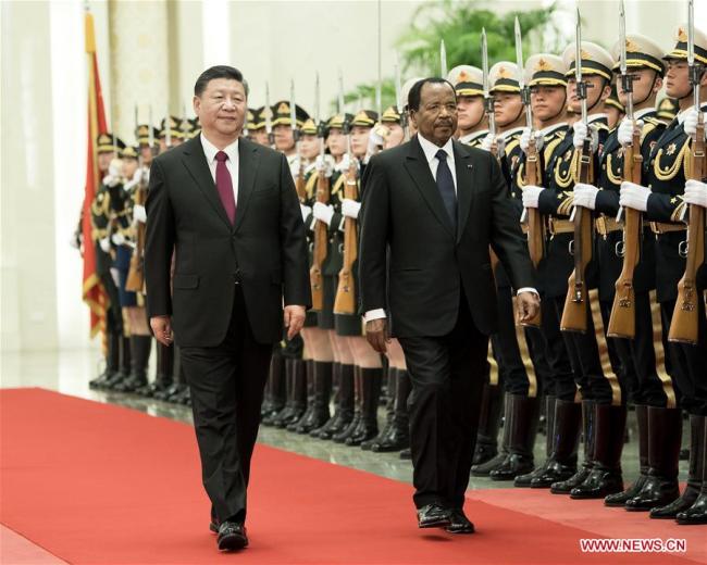 Chinese President Xi Jinping (L) holds a welcome ceremony for visiting Cameroonian President Paul Biya before their talks at the Great Hall of the People in Beijing, capital of China, March 22, 2018. [Photo: Xinhua/Li Tao]