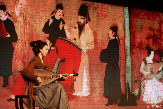 In 2015, the Forbidden City released an application to introduce a painting Han Banquet Map to the general public. Users are able to listen to audio about the story, as well as the tones played by the performer depicting in the painting. [Photo: from IC]  
