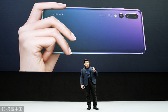 Huawei Consumer Business Group's CEO, Richard Yu, attends the launch of the new Huawei P20 smartphone, the new generation smartphones of the Chinese brand Huawei at Le Grand Palais on March 27, 2018 in Paris, France. The world's third-largest smartphone maker Huawei launches two new high-end models, the Huawei P20 and Huawei P20 pro to compete with Samsung Galaxy S9 and Apple's iPhone 8. [Photo: VCG]