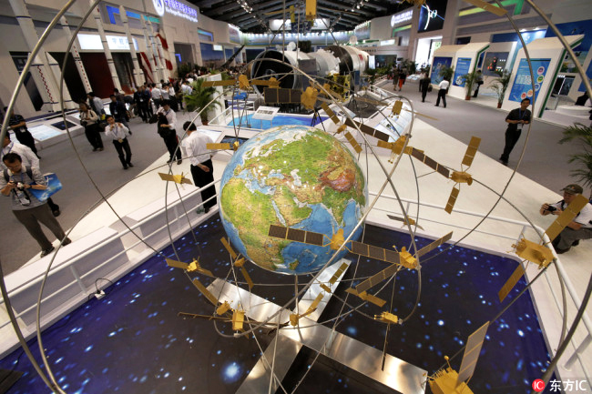 A model of the Beidou satellite navigation system on display during an exhibition in Beijing, September 26, 2017. [Photo: IC]