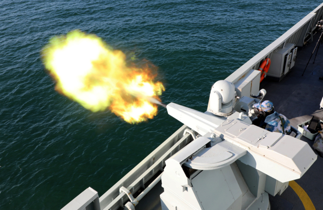 The guided-missile frigate Fushun (Hull 591) attached to a frigate flotilla of the navy under the PLA Northern Theater Command fires its close-in weapons system during a 6-day maritime realistic training exercise at an undisclosed sea area from March 5 to 10, 2018. [File Photo: chinamil.com.cn/Huang Liang]