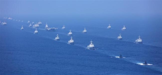 Vessels and aircraft including the aircraft carrier Liaoning and latest submarines, vessels and fighter jets take part in a review in the South China Sea on April 12, 2018. Chinese President Xi Jinping, also general secretary of the Communist Party of China Central Committee and chairman of the Central Military Commission, reviewed the Chinese People's Liberation Army (PLA) Navy in the South China Sea Thursday morning and made a speech after the review.[Photo:Xinhua]