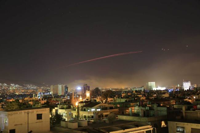 Damascus skies erupt with anti-aircraft fire as the U.S. launches an attack on Syria targeting different parts of the Syrian capital Damascus, Syria, early Saturday, April 14, 2018. [Photo: AP/Hassan Ammar] 
