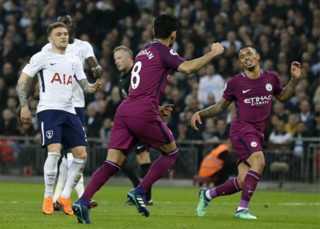 Manchester City's Ilkay Gundogan celebrates with teammate Gabriel Jesus, right, after scoring side's second goal from the penalty spot during the English Premier League soccer match between Tottenham Hotspur and Manchester City at Wembley stadium in London, England, Saturday, April 14, 2018. [Photo: AP]