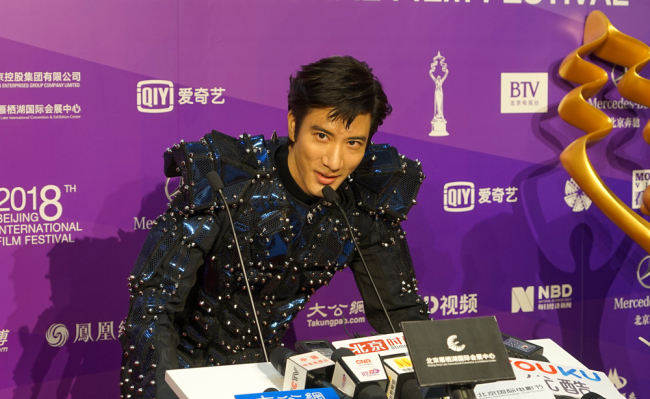 Chinese-American singer Leehom Wang is interviewed on the red carpet of the 8th Beijing International Film Festival on Sunday, April 15, 2018. [Photo: China Plus]