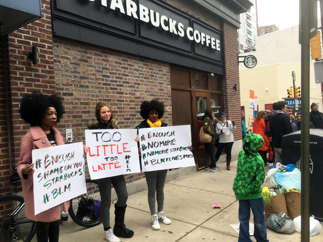 Protesters gather outside a Starbucks in Philadelphia, Sunday, April 15, 2018, where two black men were arrested Thursday after Starbucks employees called police to say the men were trespassing. The arrest prompted accusations of racism on social media. Starbucks CEO Kevin Johnson posted a lengthy statement Saturday night, calling the situation "disheartening" and that it led to a "reprehensible" outcome. [Photo: AP/Ron Todt]