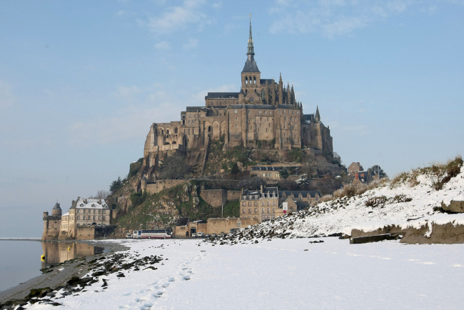 General view of Le Mont Saint Michel under snow, Thursday, Dec. 2, 2010. [File Photo: AP/David Vincent]