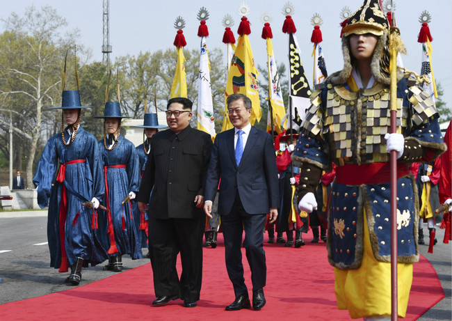 North Korean leader Kim Jong Un, left, and South Korean President Moon Jae-in walk together at the border village of Panmunjom in the Demilitarized Zone Friday, April 27, 2018. [Photo: AP]