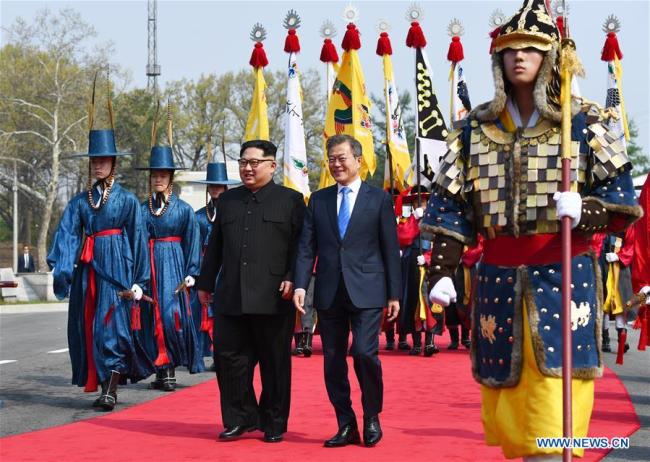 South Korean President Moon Jae-in (R) meets with top leader of the Democratic People's Republic of Korea (DPRK) Kim Jong Un in the border village of Panmunjom on April 27, 2018. Moon Jae-in arrived Friday morning in the border village of Panmunjom for his first summit with Kim Jong Un.[Photo: Xinhua/Inter-Korean Summit Press Corps]