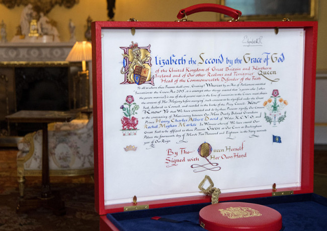 A picture released by Buckingham Palace on May 11, 2018, shows the Instrument of Consent signed by Queen Elizabeth II that allows her "Most Dearly Beloved Grandson" to marry Meghan Markle. [Photo: AP]
