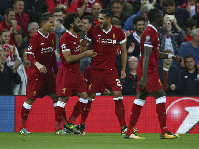Emre Can(2nd,right) celebrates after he scores his sides third goal during the Champions League qualifying play-off second leg soccer match between Liverpool and Hoffenheim at Anfield stadium in Liverpool, England, Wednesday, Aug. 23, 2017. [Photo: AP]