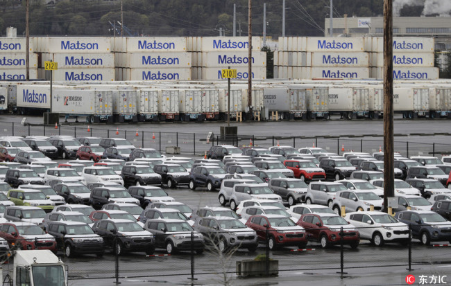 New cars and cargo containers are shown in a staging area, Friday, April 6, 2018, at the Port of Tacoma in Tacoma, U.S. [File Photo: IC]