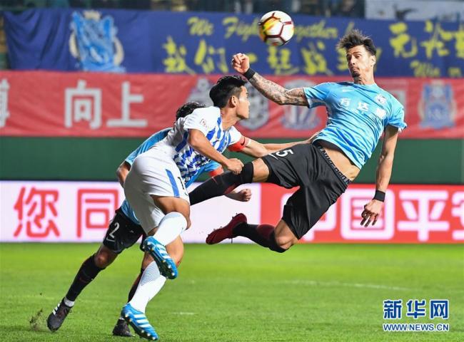 Jose Fonte (in blue) [Photo: Xinhua]