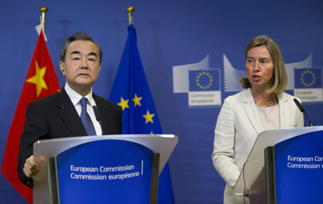 European Union foreign policy chief Federica Mogherini, right, and China's Foreign Minister Wang Yi participate in a media conference at EU headquarters in Brussels, Friday, June 1, 2018.[Photo: AP/Virginia Mayo]