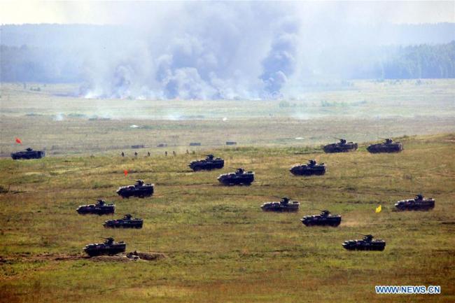 Chinese armored vehicles move forwards the target during the "Peace Mission 2007" anti-terror drill involving member states of the Shanghai Cooperation Organization (SCO) in Chelyabinsk of Russia, Aug. 17, 2007. The 18th Shanghai Cooperation Organization (SCO) Summit is scheduled for June 9 to 10 in Qingdao, a coastal city in east China's Shandong Province. [Photo: Xinhua]