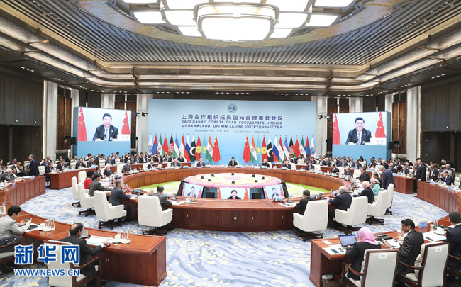 Chinese President Xi Jinping chairs the 18th Meeting of the Council of Heads of Member States of The Shanghai Cooperation Organization (SCO) and delivers a speech in Qingdao on Sunday, June 10, 2018. [Photo: Xinhua]