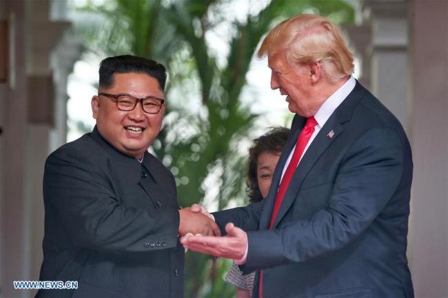 Top leader of the Democratic People's Republic of Korea (DPRK) Kim Jong Un (L) meets with U.S. President Donald Trump in Singapore, on June 12, 2018.[Photo: Xinhua]