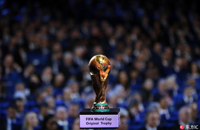 In this Friday Dec. 1, 2017 file ., the World Cup trophy is placed on display during the 2018 soccer World Cup draw in the Kremlin in Moscow. [File Photo: IC]