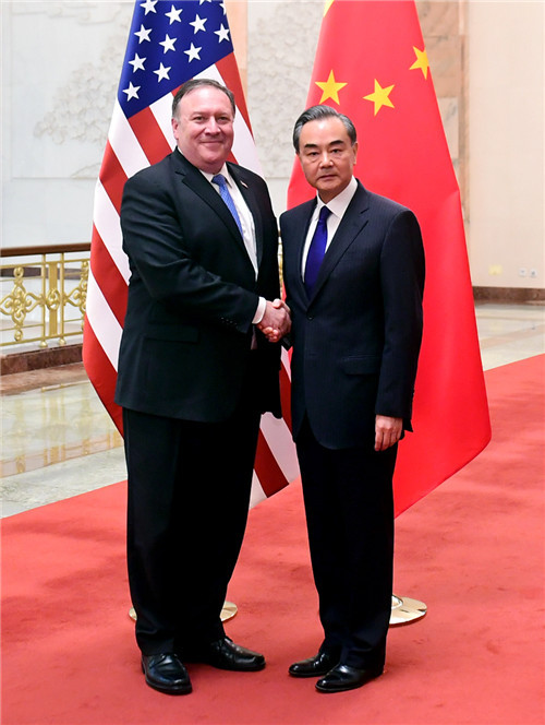 Chinese Foreign Minister Wang Yi shakes hands with U.S. Secretary of State Mike Pompeo during their meeting in Beijing on Jun 14, 2018. [Photo: gov.cn]