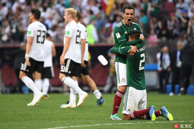 Jubilation at the Mexicans after the game: Rafael Marquez (Mexico) with Hugo Ayala (Mexico). Behind it German player is disappointed, June 17, 2018. [Photo: IC]