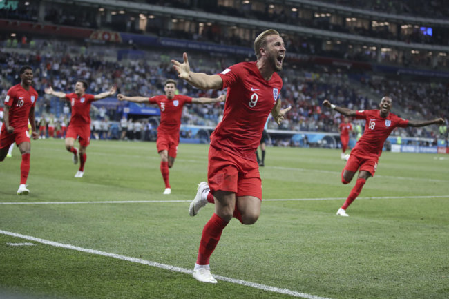 Harry Kane celebrates after scoring during the group G match between Tunisia and England at the 2018 soccer World Cup in the Volgograd Arena in Volgograd, Russia, Monday, June 18, 2018. 
