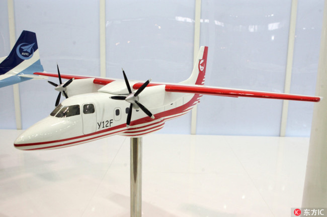 A model of the Y-12F regional turboprop aircraft is on display at the stand of AVIC during the Aviation Expo / China 2009 in Beijing, China, 23 September 2009. [Photo: IC]