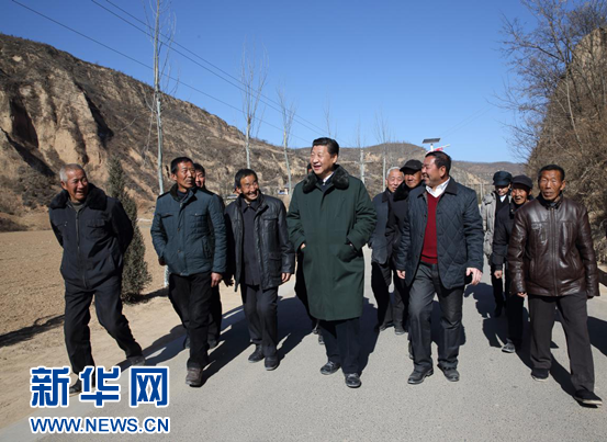 Chinese President Xi Jinping visits locals in Liangjiahe Village, Yanan City, in northwest China’s Shaanxi Province on February 13, 2015. [File photo: Xinhua]