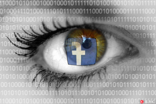 Facebook logo is reflected in the eyes of a worried-looking woman with binary numbers.[File Photo: IC]