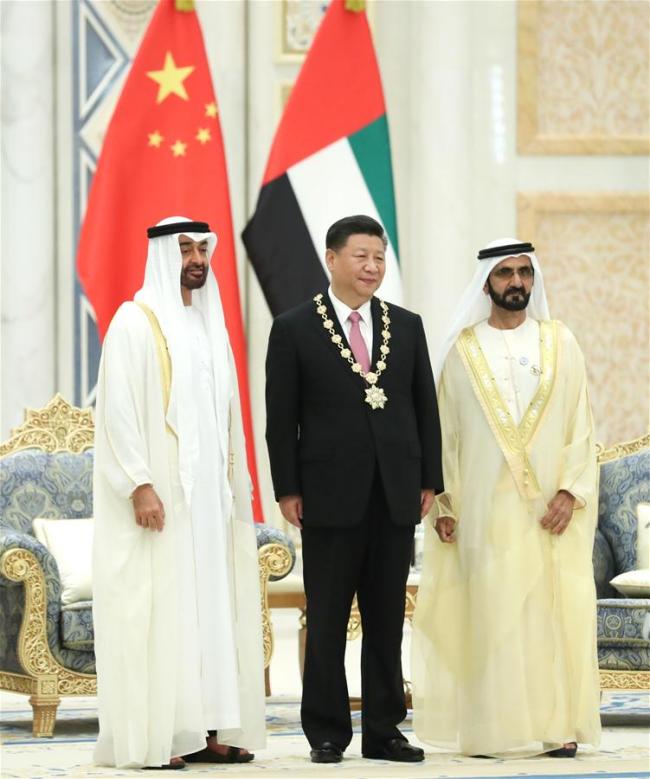 Chinese President Xi Jinping is conferred with the Order of Zayed, the UAE's highest civil decoration after talks with UAE Vice President and Prime Minister Sheikh Mohammed bin Rashid Al Maktoum and Crown Prince of Abu Dhabi Sheikh Mohammed bin Zayed Al Nahyan in Abu Dhabi, the United Arab Emirates (UAE), July 20, 2018.[Photo: Xinhua/Pang Xinglei]