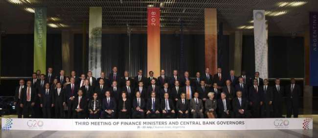 Family picture of Finance Ministers and Central Bank Governors of the G20, during their meeting in Buenos Aires, on July 21, 2018 [Photo: AFP/Eitan Abramovich]
