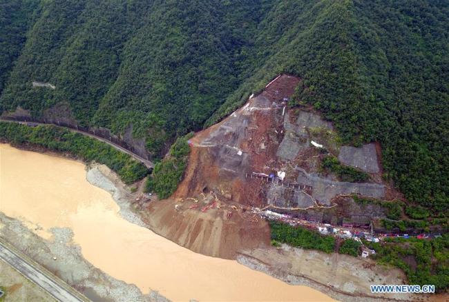 Aerial photo taken on July 28, 2018 shows rescuers working at the accident site in a section of the Baoji-Chengdu railway caused by rain-triggered landslides in Lueyang County, northwest China's Shaanxi Province. [Photo: Xinhua]