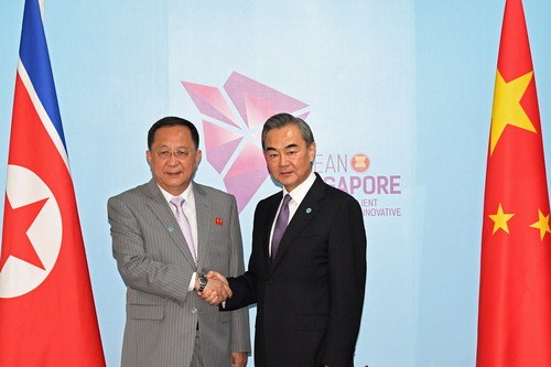 Chinese State Councilor and Foreign Minister Wang Yi (R) meets with  DPRK Foreign Minister Ri Yong Ho on the sidelines of the Association of Southeast Asian Nations (ASEAN) foreign ministers' meeting and related meetings in Singapore, August 3, 2018. [Photo: fmprc.gov.cn]