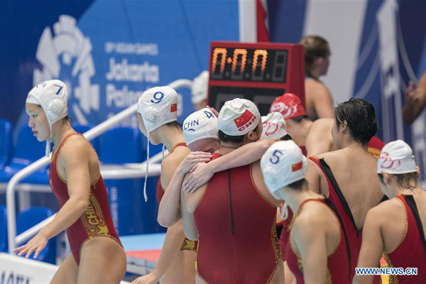 Players of China celebrate after women's water polo tournament Group A match against Kazakhstan at the 18th Asian Games in Jakarta, Indonesia, on August 16, 2018. China won 11-4. [Photo: Xinhua/Fei Maohua]