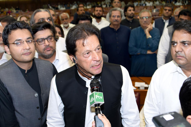 In this handout photograph released by the National Assembly (NA) on August 17, 2018, Pakistan's newly appointed Prime Minister Imran Khan (C) addresses the lawmakers after been elected by National Assembly in Islamabad on August 17, 2018. [Photo: Handout/NA/AFP]