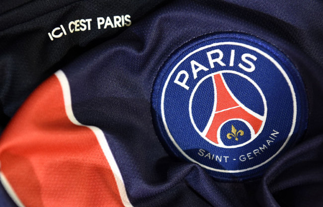 A photo taken on August 6, 2015 in Paris, shows a partial view of the new jersey of the Paris Saint Germain (PSG) football team. [File Photo: AFP/FRANCK FIFE] 