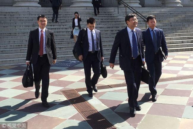 Members of a Chinese delegation led by Vice Minister of Commerce and Deputy China International Trade Representative Wang Shouwen (2nd R) leave the building of the US Treasury after two days of talks with US representatives in Washington, DC, on August 23, 2018. [Photo: VCG]