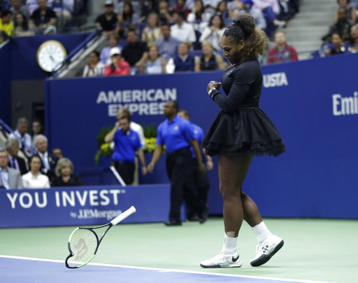 Serena Williams slams her racket on the court during the women's final of the U.S. Open tennis tournament against Naomi Osaka, of Japan, Saturday, Sept. 8, 2018, in New York. [Photo: AP/Julio Cortez]