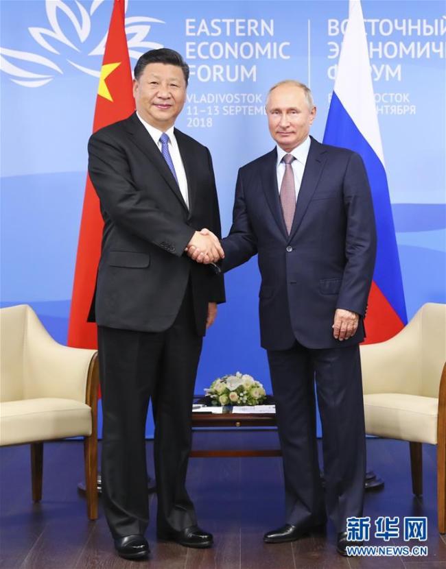 Chinese President Xi Jinping and Russian President Vladimir Putin meet in Vladivostok on September 11, 2018. [Photo: Xinhua]