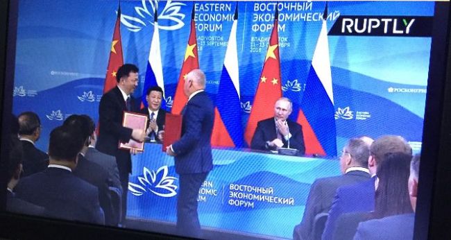 Screenshot of the RT TV network showing the signing ceremony of the strategic cooperation treaty between China Media Group and Rossiya Segodnya in Vladivostok, September 11, 2018. [Photo: CCTV]