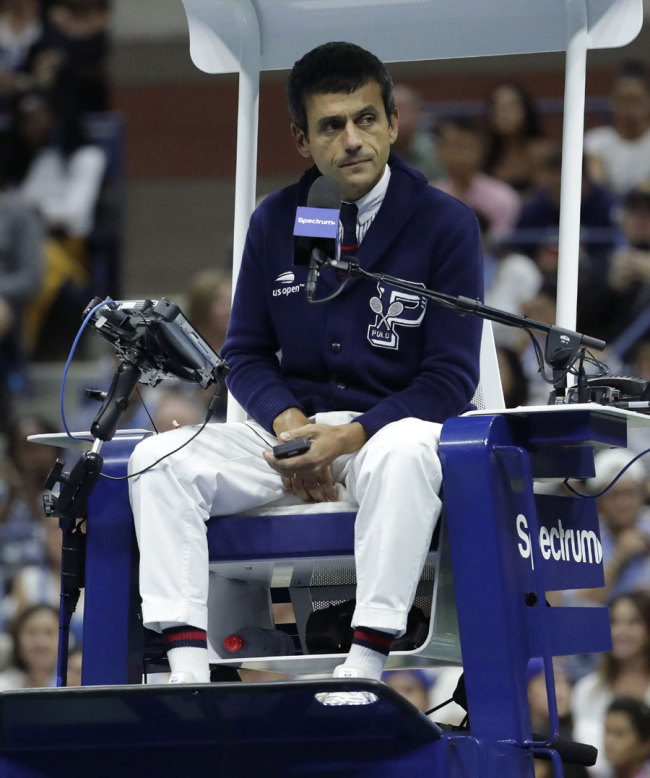Chair umpire Carlos Ramos watches play as he officiates the match between Serena Williams and Naomi Osaka, of Japan, during the women's final of the U.S. Open tennis tournament, Saturday, Sept. 8, 2018, in New York. [Photo: AP/Julio Cortez]