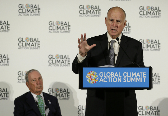 California Gov. Jerry Brown speaks as Michael Bloomberg, left, listens during a news conference at the Global Action Climate Summit Thursday, Sept. 13, 2018, in San Francisco. [Photo: AP/Eric Risberg]