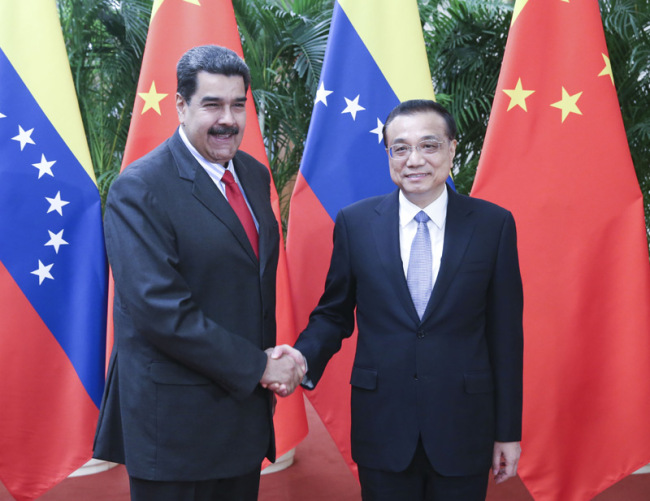 Chinese Premier Li Keqiang meets with visiting Venezuelan President Nicolas Maduro at the Great Hall of the People in Beijing on Friday, September 14, 2018.[Photo: gov.cn]