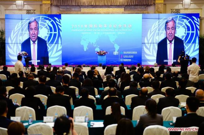 A congratulatory video from UN Secretary-General Antonio Guterres is shown at the opening ceremony of a commemorative event for the International Day of Peace 2018 held in Nanjing, east China's Jiangsu Province, Sept. 19, 2018. [Photo: Xinhua]