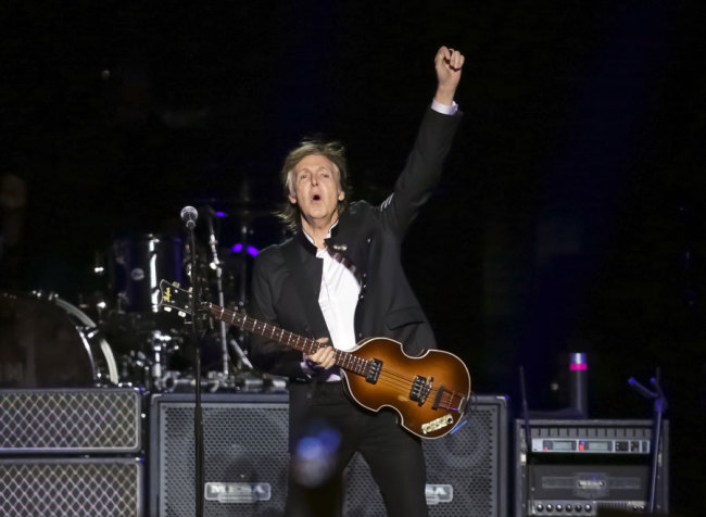 In this Monday, Sept. 11, 2017 file photo, singer/songwriter Paul McCartney performs on stage at the Prudential Center in Newark, NJ. Former Beatle McCartney has told a British newspaper he believes he once saw God during a psychedelic trip. The 76-year-old music legend told The Sunday Times he was “humbled” by the experience. The music legend is promoting a new album and a fall tour, it was reported on Sunday, Sept. 2, 2018. [Photo by Brent N. Clarke/Invision/AP]