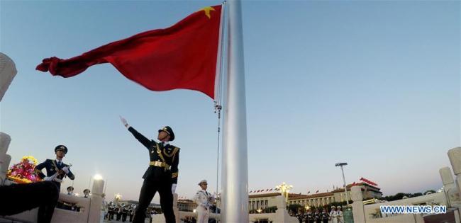 A national flag raising ceremony is held at the Tian'anmen Square in Beijing, capital of China, on Oct. 1, 2018, the National Day, to celebrate the 69th anniversary of the founding of the People's Republic of China. [Photo: Xinhua]