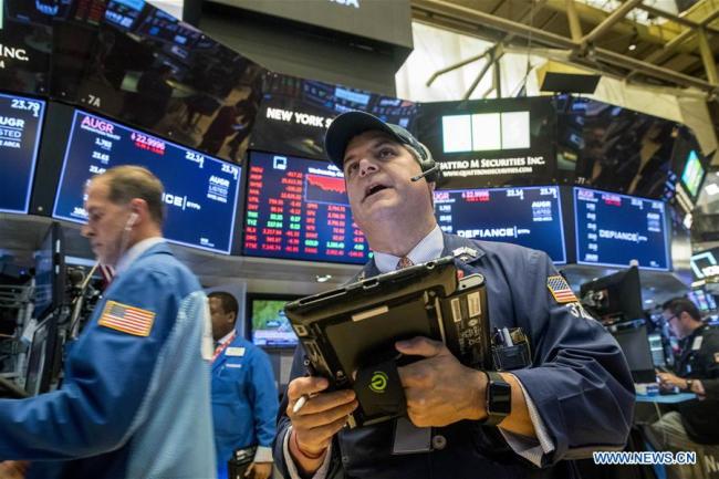 Traders work at the New York Stock Exchange in New York, the United States, Oct. 10, 2018. [Photo: Xinhua]